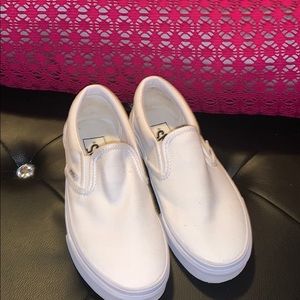 All white slip on vans